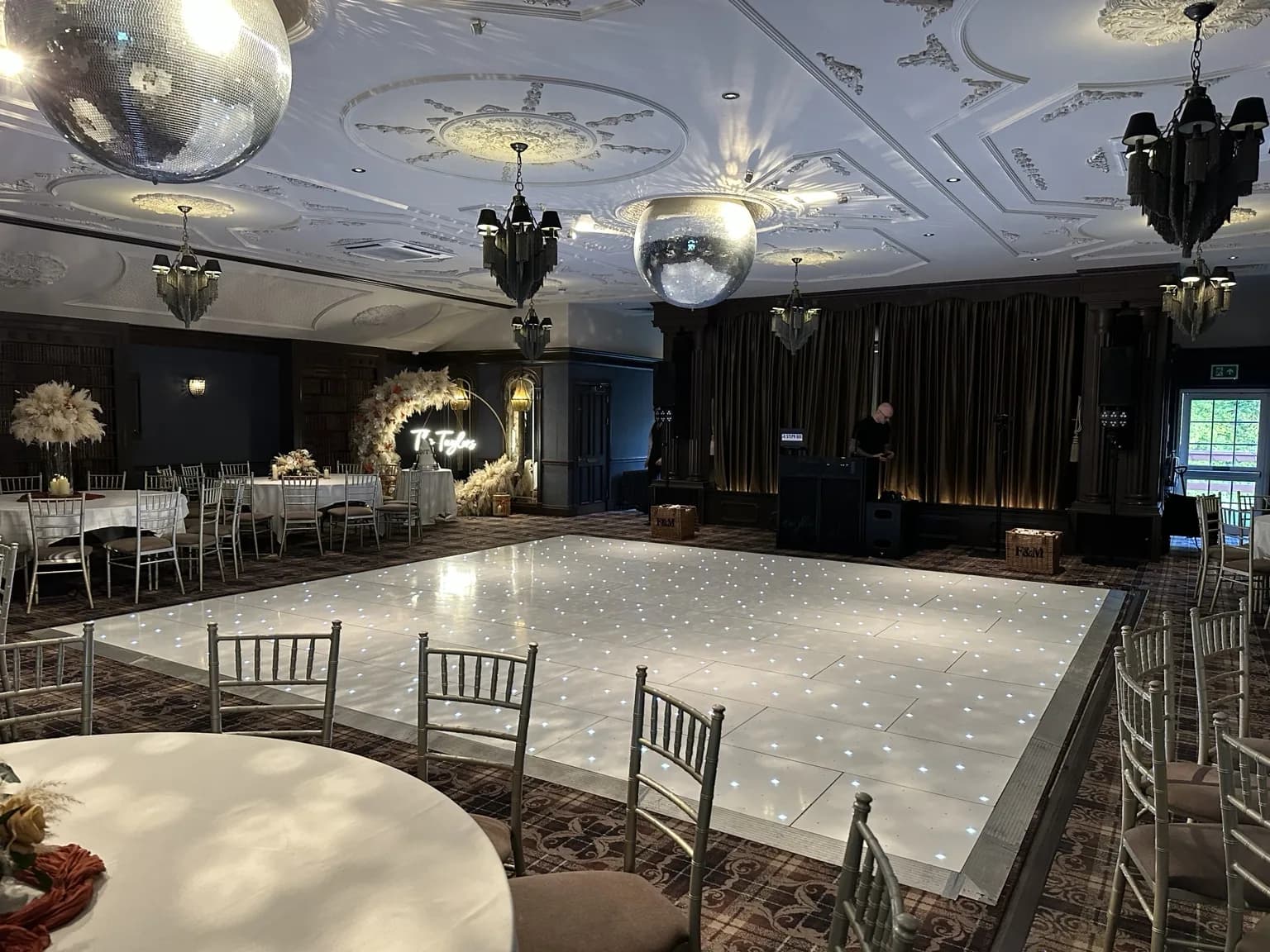 Large white starlit LED dance floor installed for a wedding