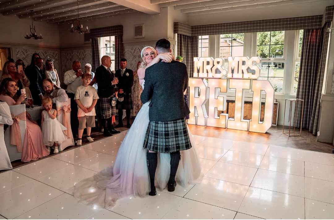 Wedding first dance with LED floor and surname letters in Scotland