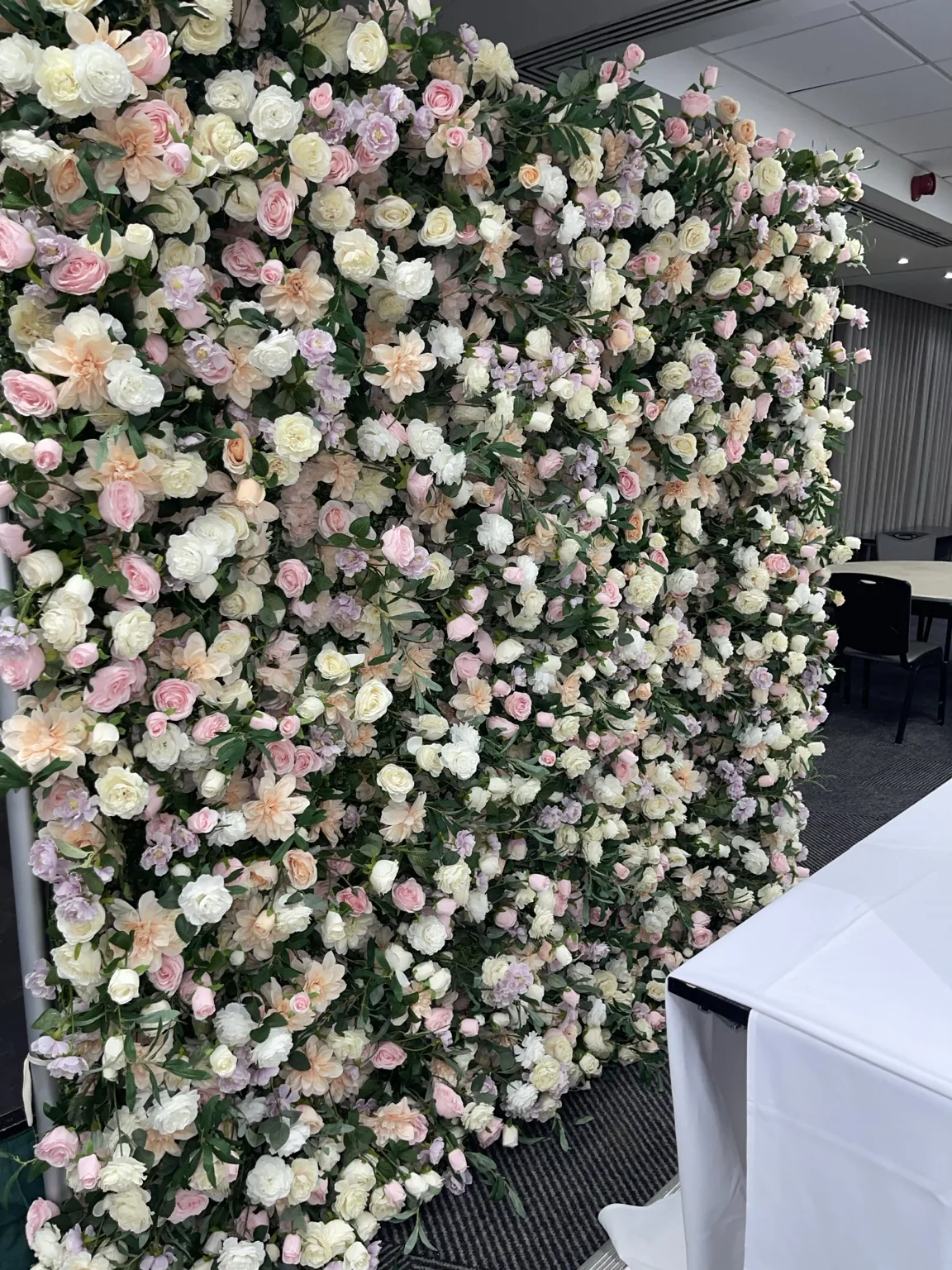 Full pastel flower wall backdrop with blush pink cream and green flowers