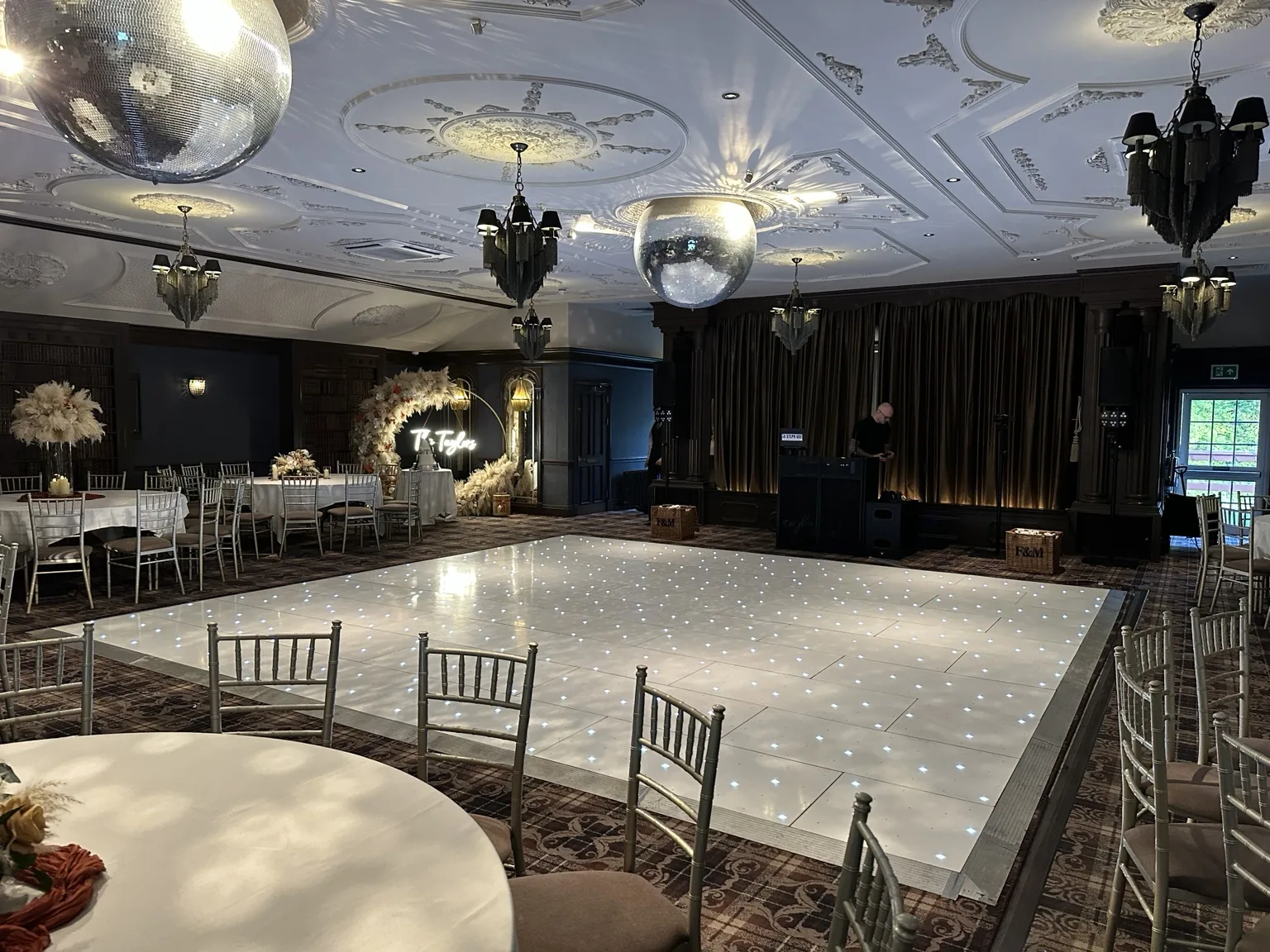 Wide white starlit LED dance floor installed through an elegant Scottish wedding room