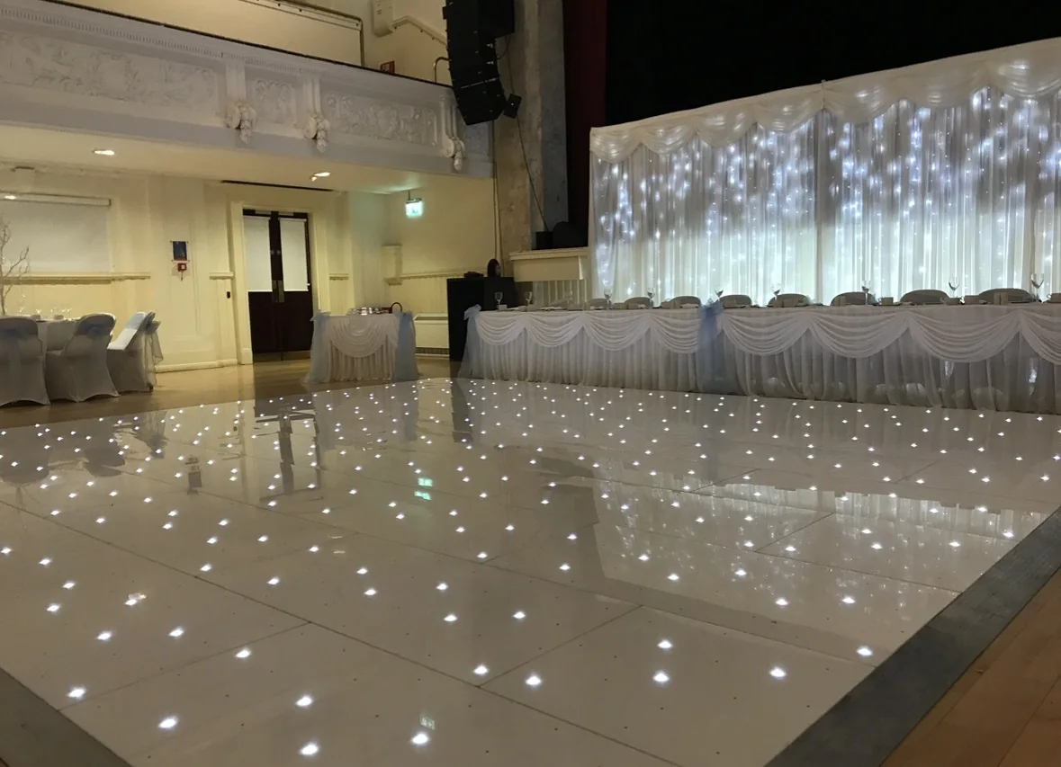 20 by 20 foot white starlit LED dance floor with LED backdrop at Airdrie Town Hall