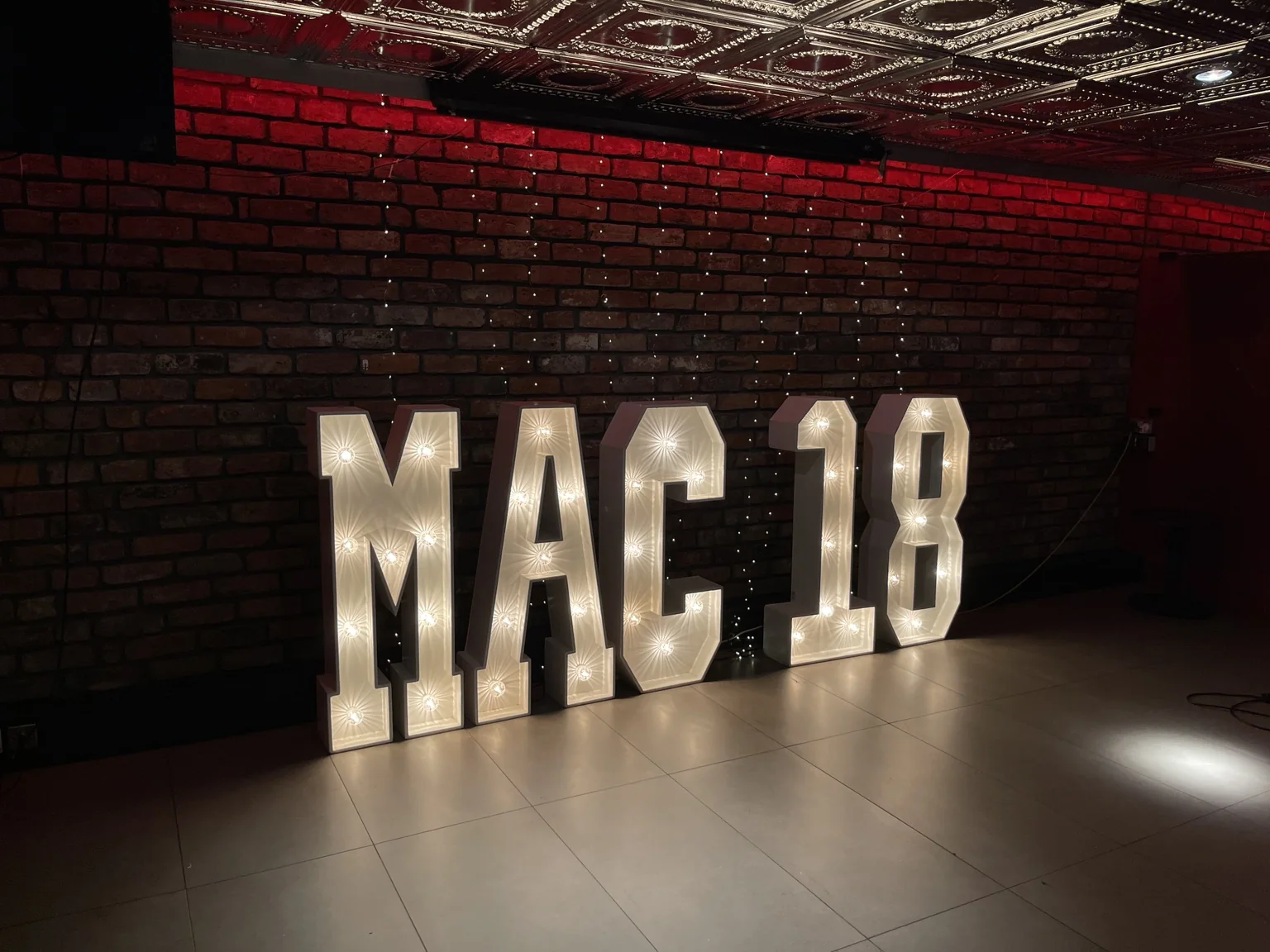 MAC18 illuminated birthday display at Angels Share and Devil's Cut Edinburgh