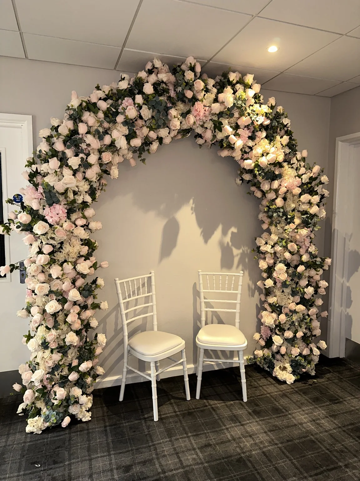 Floral styling at Barony Castle Hotel Blush and ivory floral arch installed for a Barony Castle wedding
