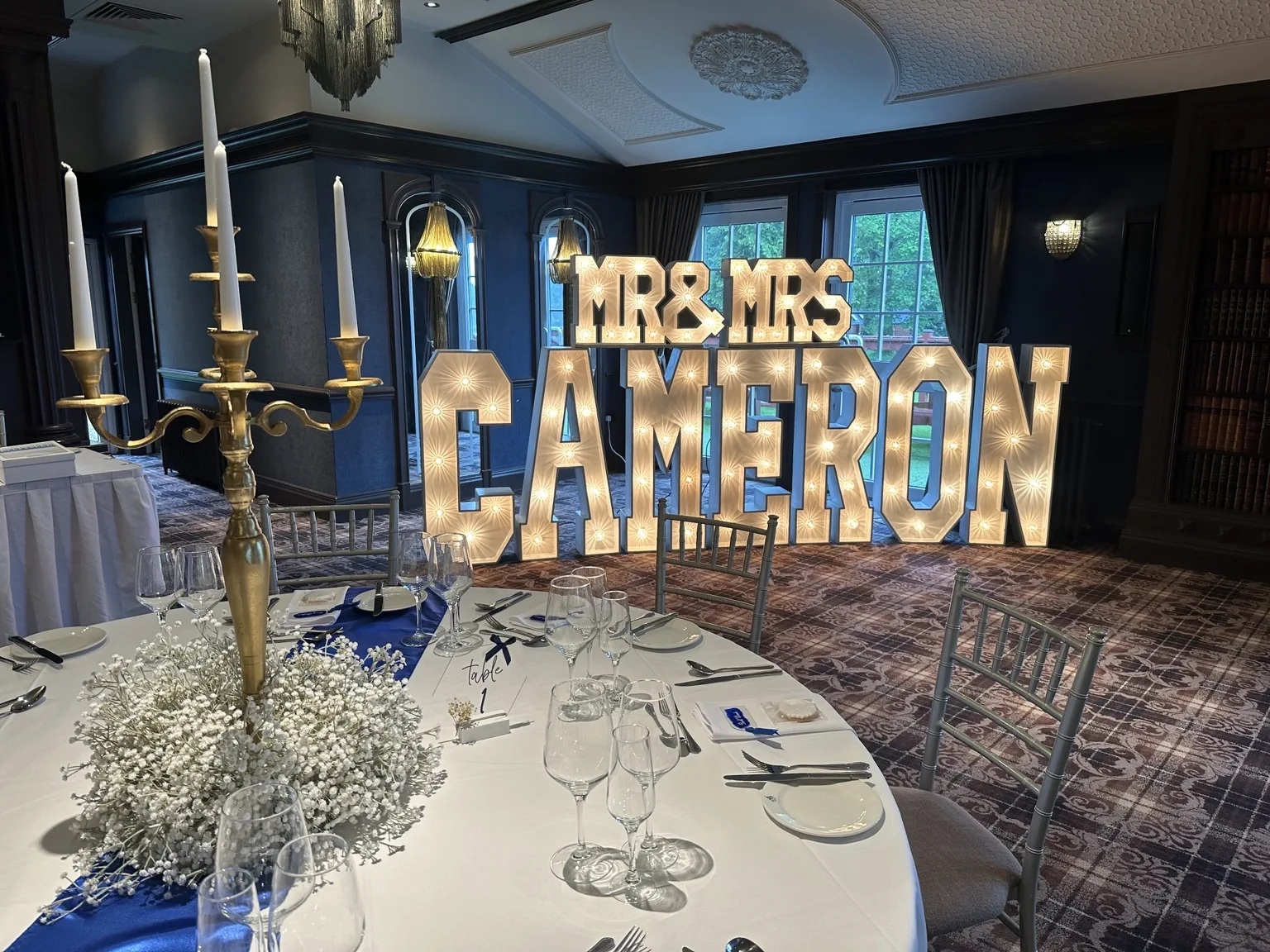 Personalised MR and MRS CAMERON illuminated letters at Cornhill Castle