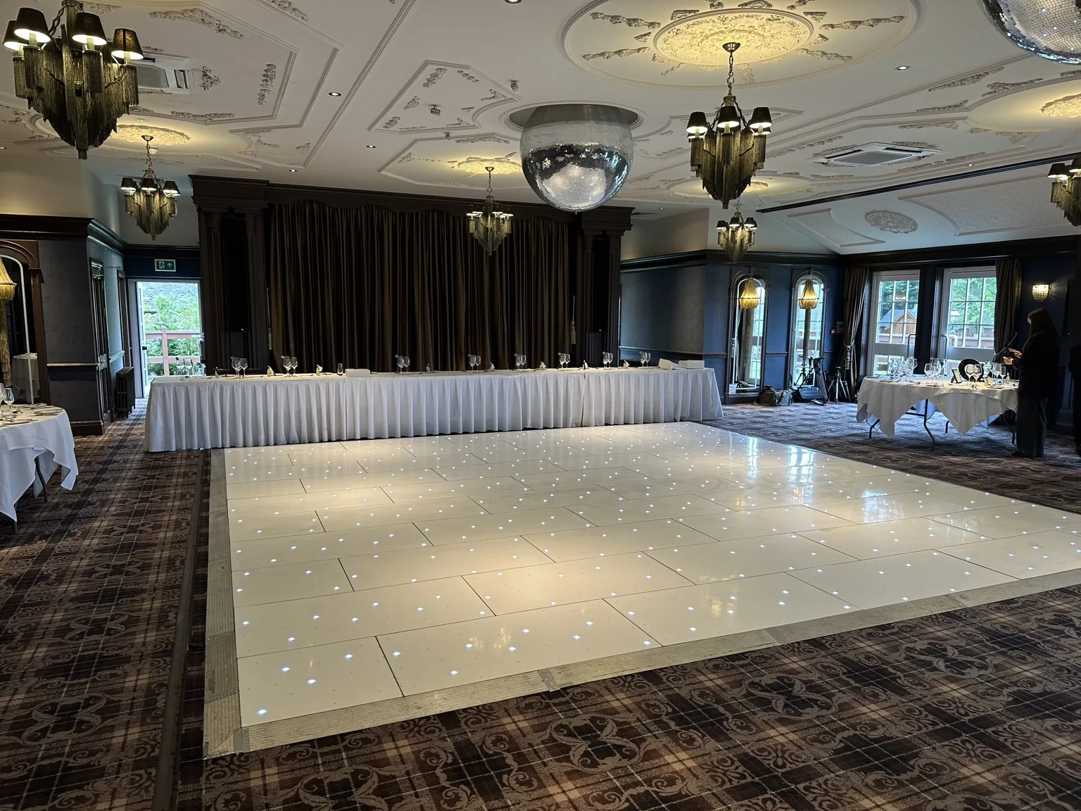Large white starlit LED dance floor installed in the main celebration room at Cornhill Castle