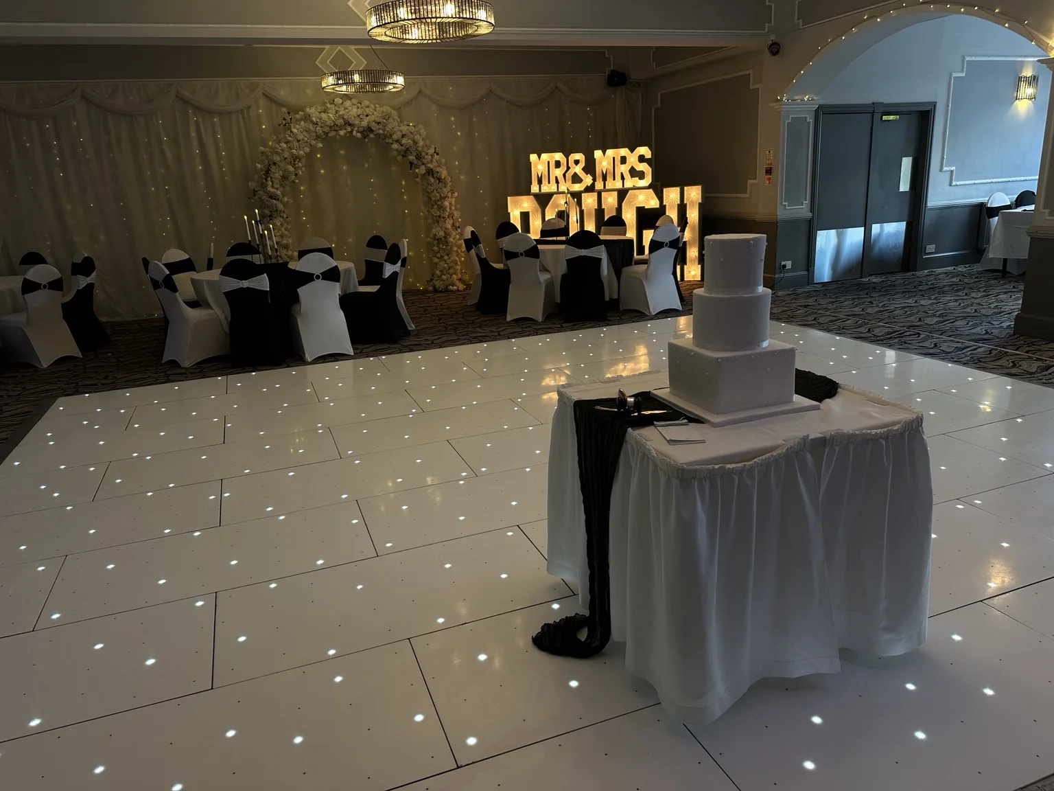 Instapic dance floor, floral arch and personalised wedding letters at The Hilcroft Hotel
