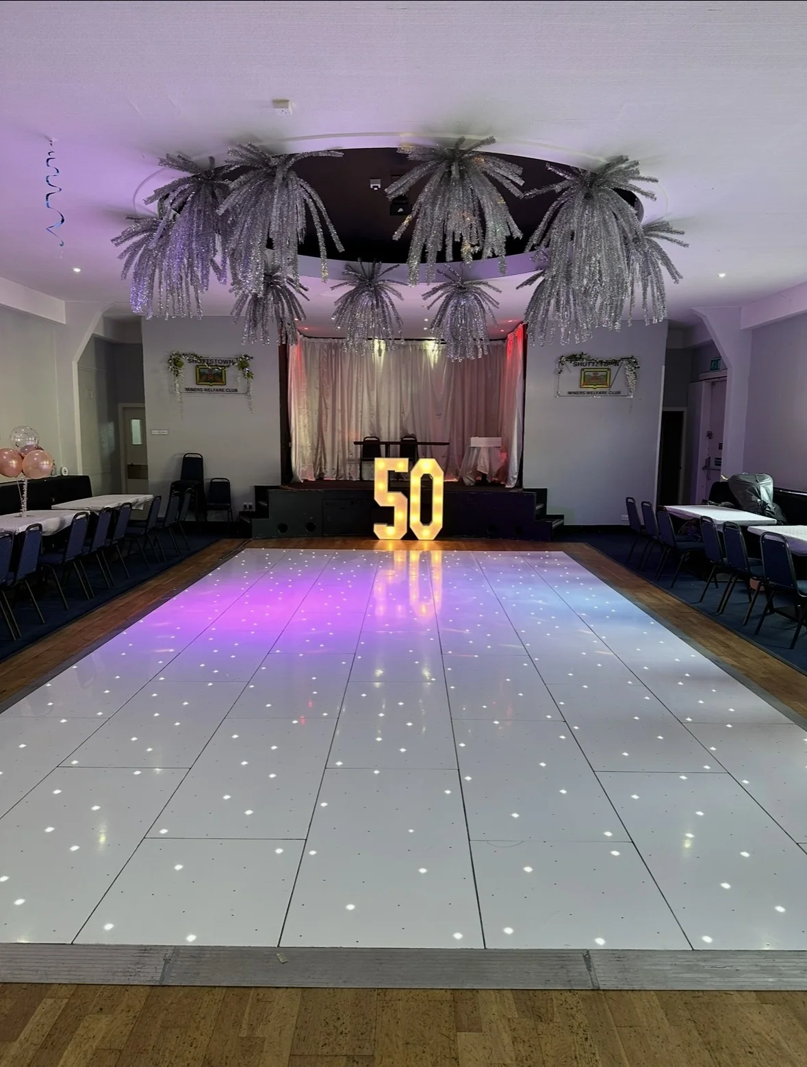 White starlit LED dance floor with illuminated 50 numbers at Shottstown Miners Welfare in Penicuik