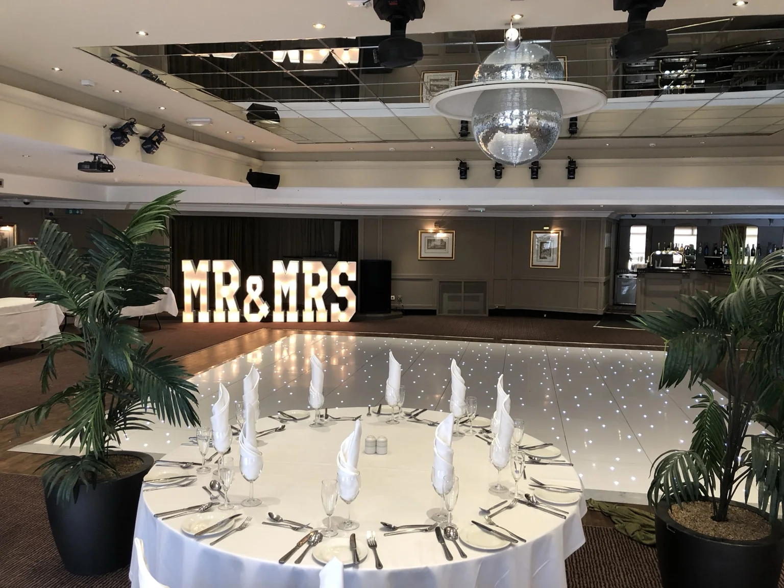 MR and MRS light-up letters beside a white LED dance floor in The Redhurst Hotel ballroom