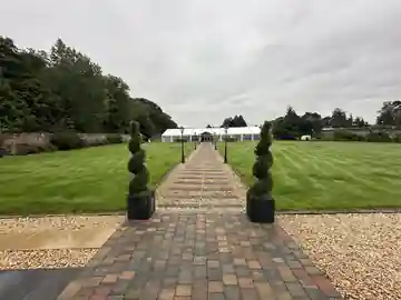 Garden path leading to The Seton Garden marquee wedding venue near Longniddry in East Lothian