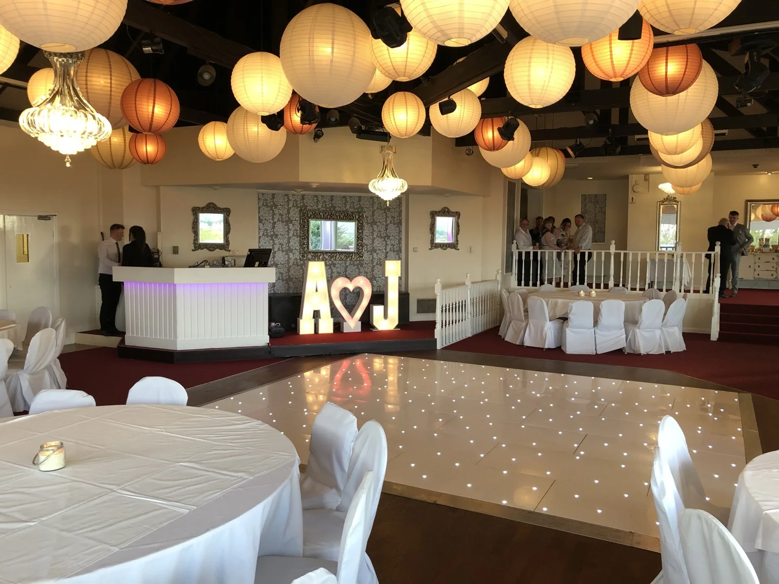 Illuminated wedding initials beside an Instapic LED dance floor at The Three Kings Falkirk