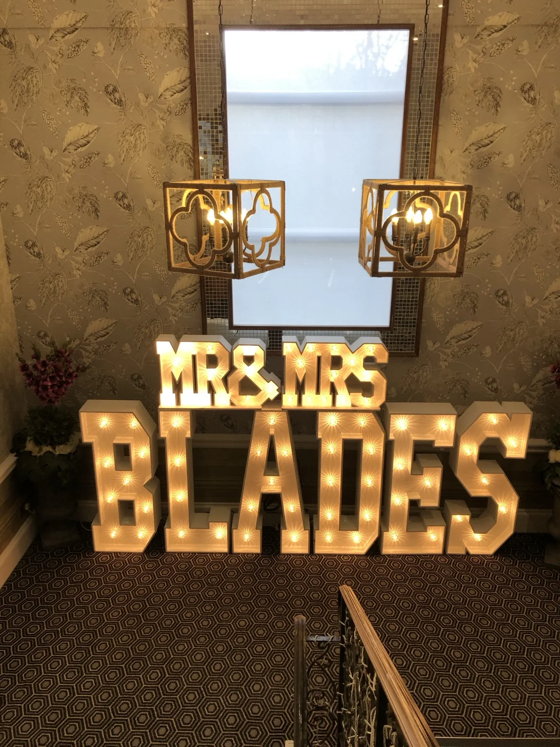 Personalised BLADES wedding light-up letters on the staircase at The Tudor Hotel Airdrie