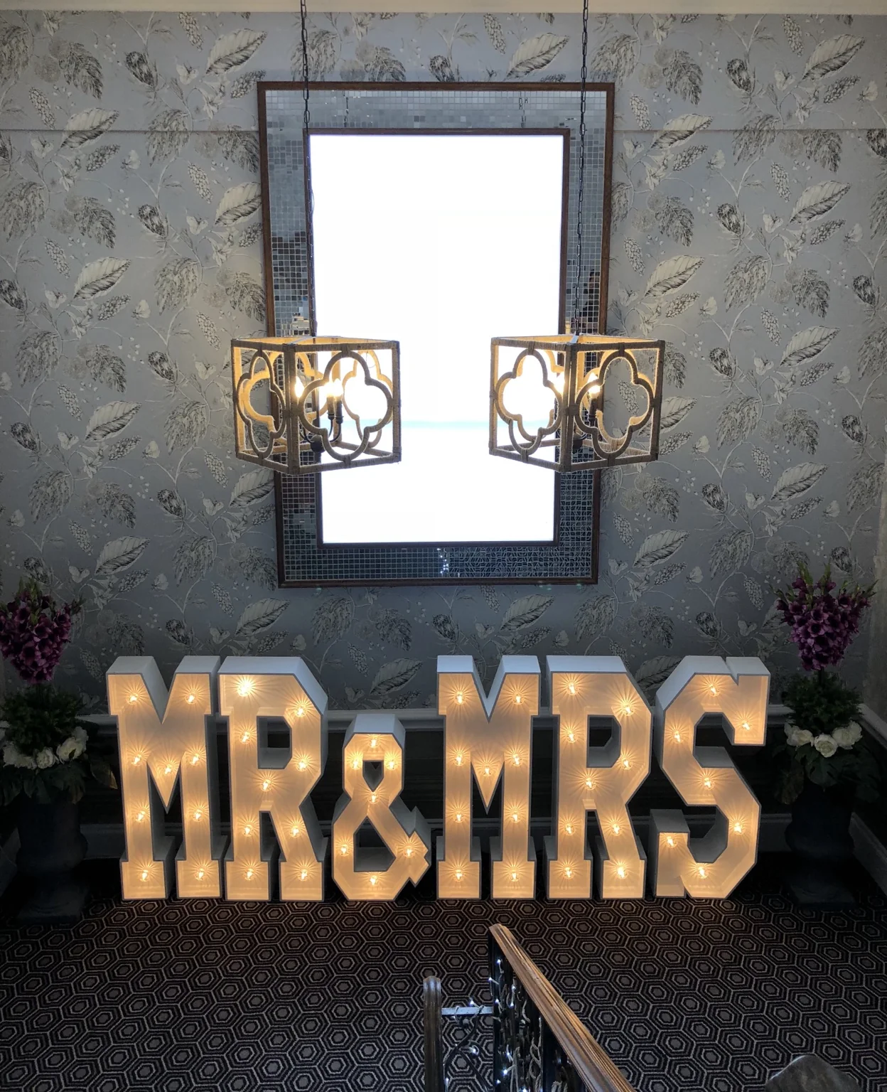 Personalised wedding light-up letters arranged on the staircase at The Tudor Hotel Airdrie