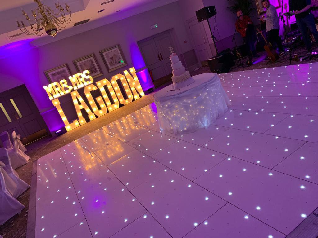 White LED dance floor with large surname letters